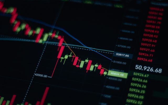 Close-up of stock market chart showing trends and data on a digital screen.