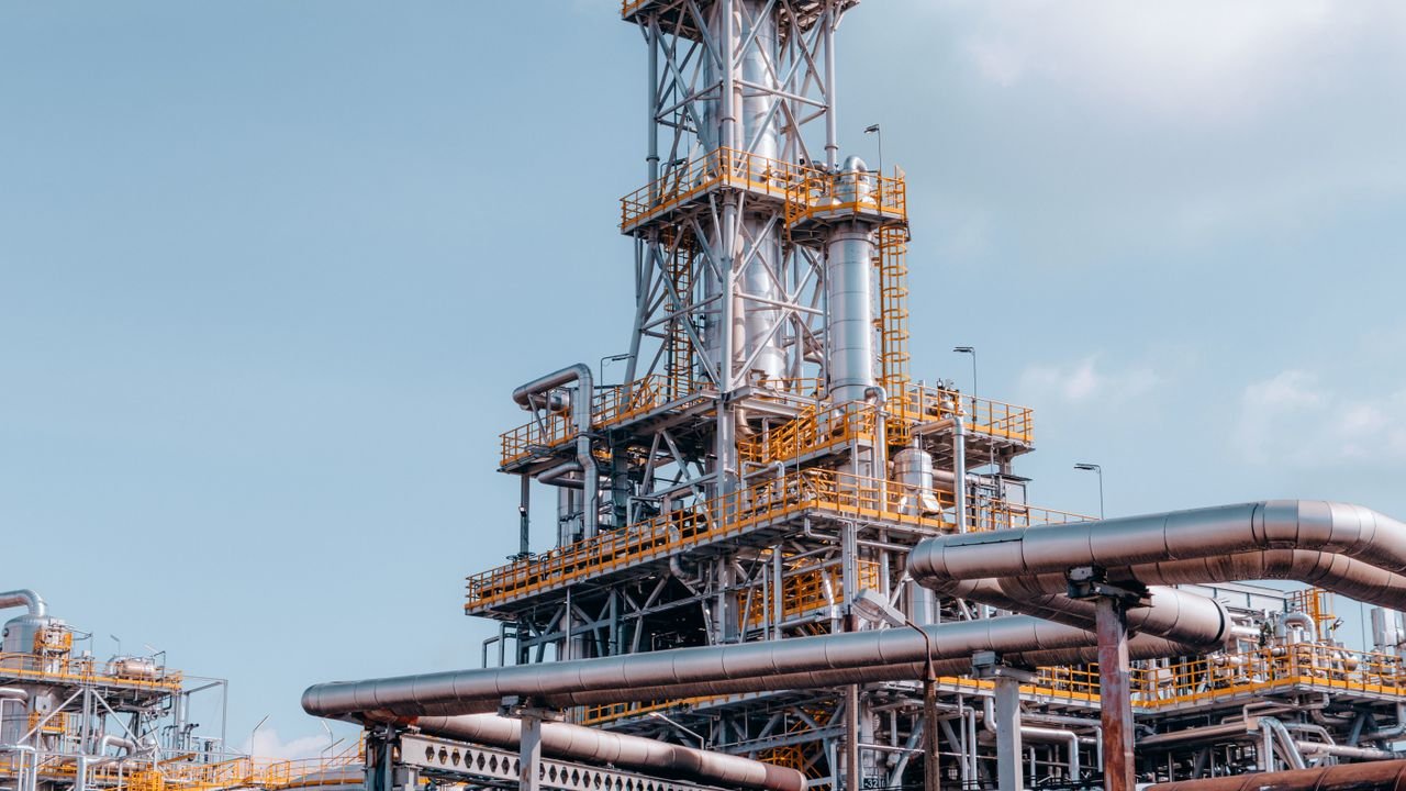 View of a large oil refinery plant with intricate pipelines in Trzebinia, Poland.