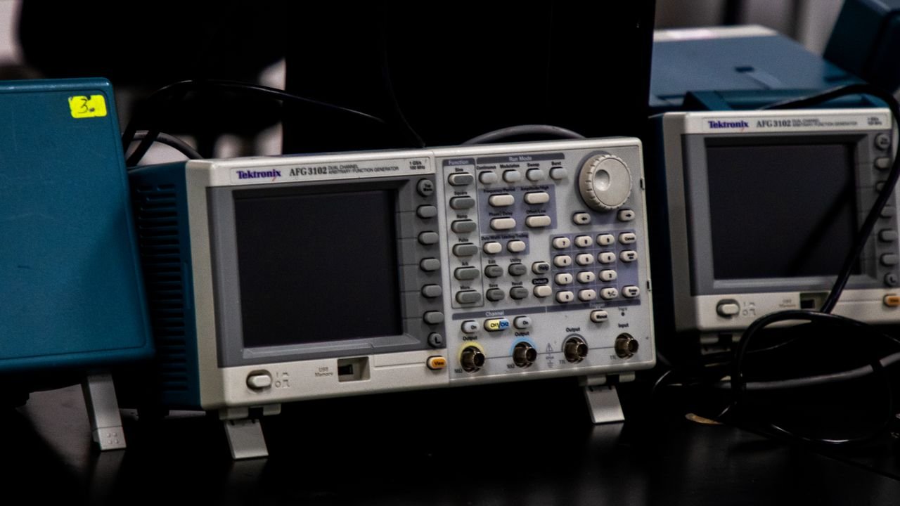Close-up of electronic measuring equipment in a lab setting, showcasing precision technology.