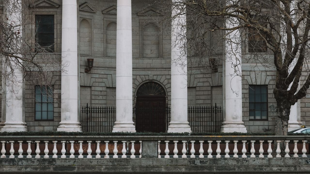 Elegant neoclassical facade of Dublin's Four Courts with iconic white columns.