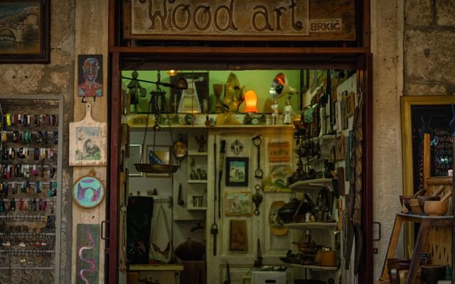 Explore a unique artisan shop with wood art and handmade crafts in a vibrant urban setting.