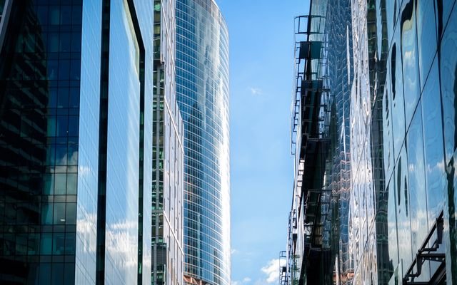 Contemporary skyscrapers reflecting the sky, showcasing modern architectural design.