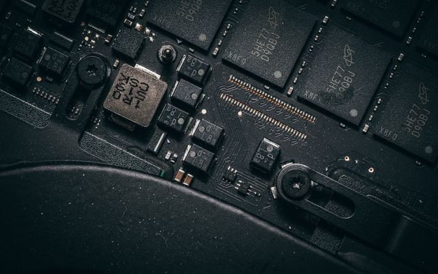 Detailed macro shot of electronic circuit board showing microchips and components.