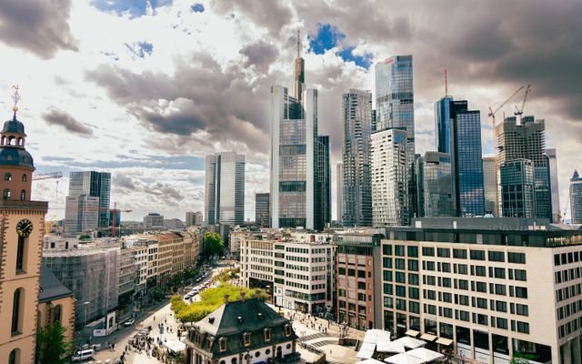 A stunning aerial view of Frankfurt's skyscrapers under dramatic skies. Perfect for business and travel enthusiasts.