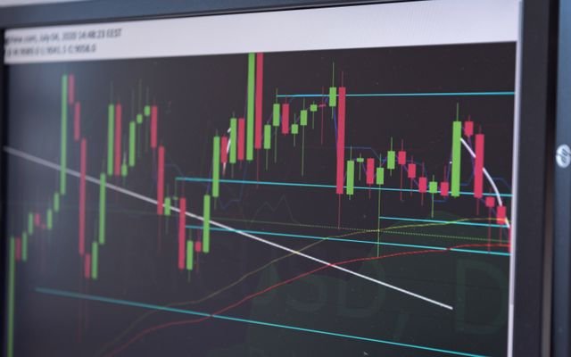 A close-up view of a cryptocurrency trading chart displayed on a monitor, showcasing market trends.